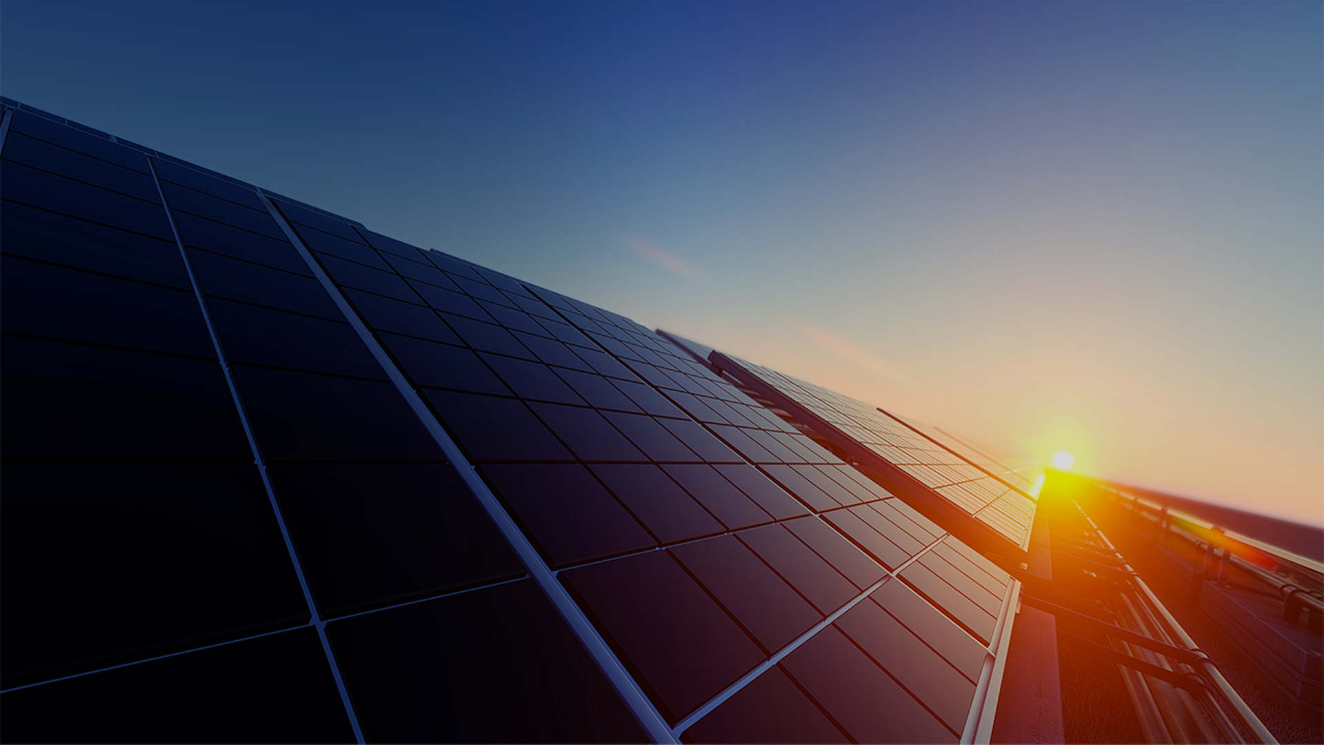 Rooftop solar panels basking in the golden light of a sunset, showcasing renewable energy in a serene setting.