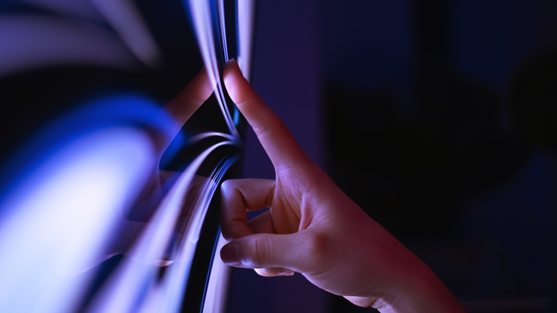 A close-up of the interaction between a person using a touch screen display.